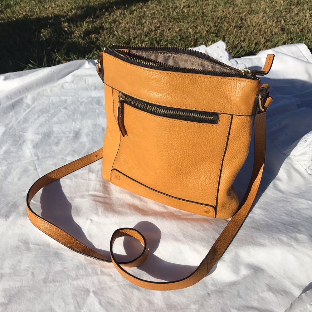 Vince Camuto  purse color orange.